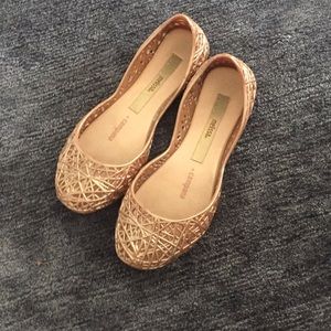 Gold sparkly shoes with desires on them